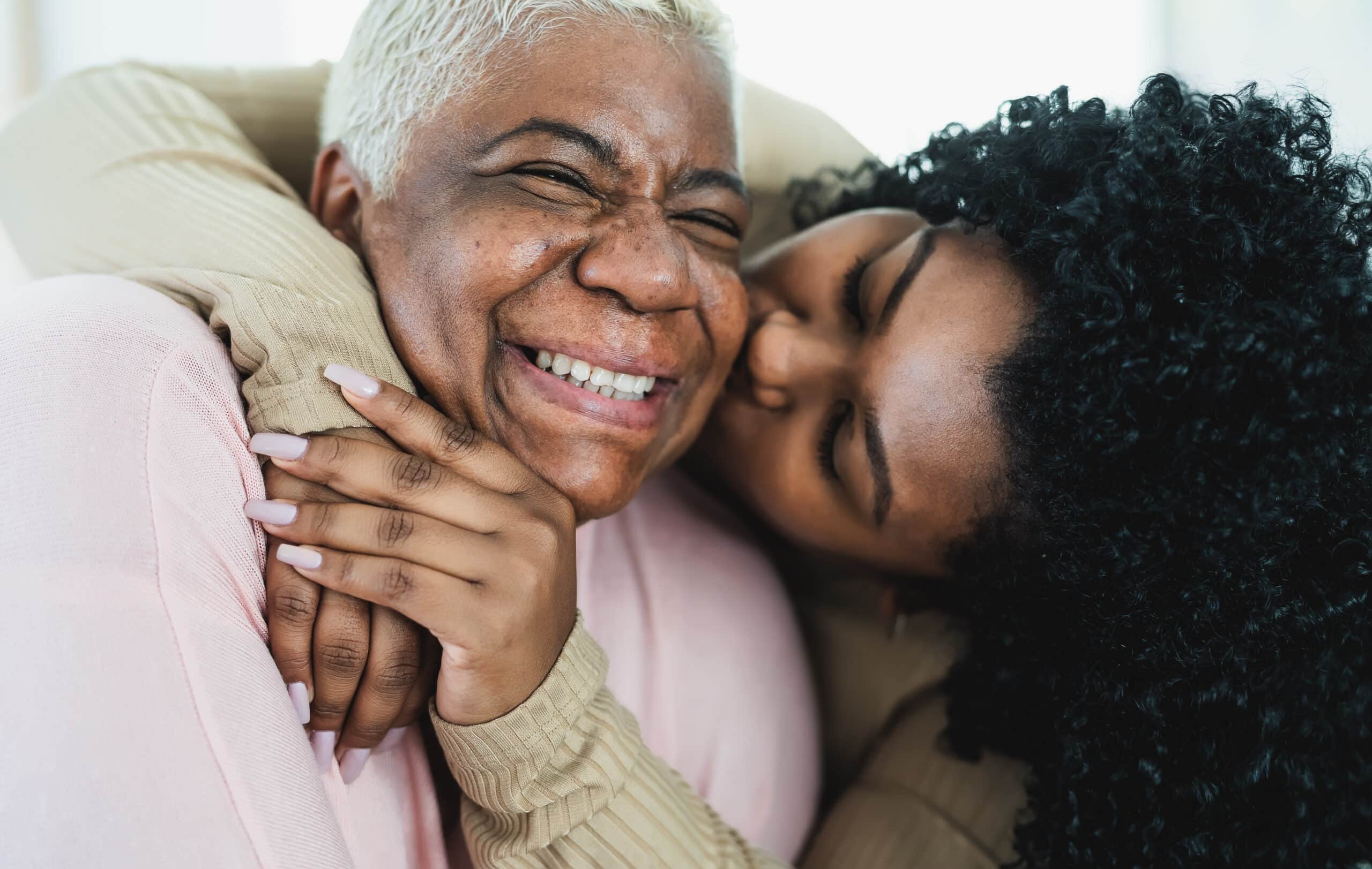 Happy elderly person visiting family in the nursing home.