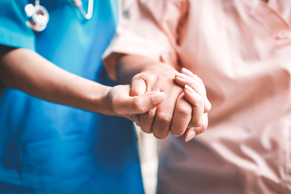 nursing holding hand of resident